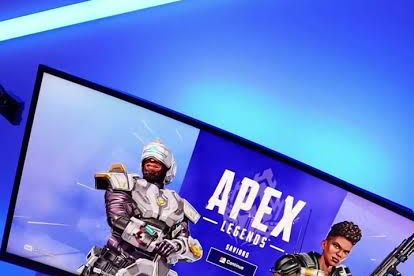 Gaming monitor on a desk with a keyboard and mouse